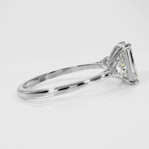Emerald and Pear Cut Lab Grown Diamond Three Stone Engagement Ring